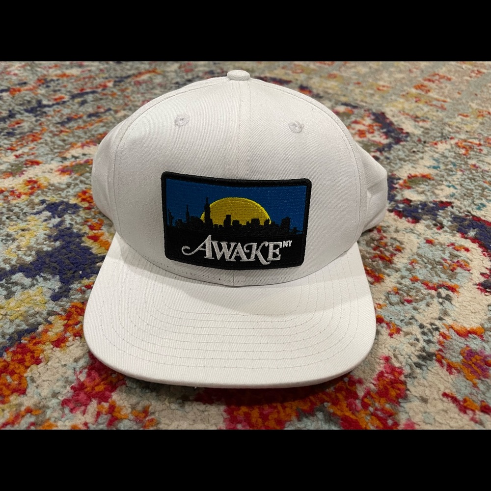 White SnapBack hat from the brand AWAKE